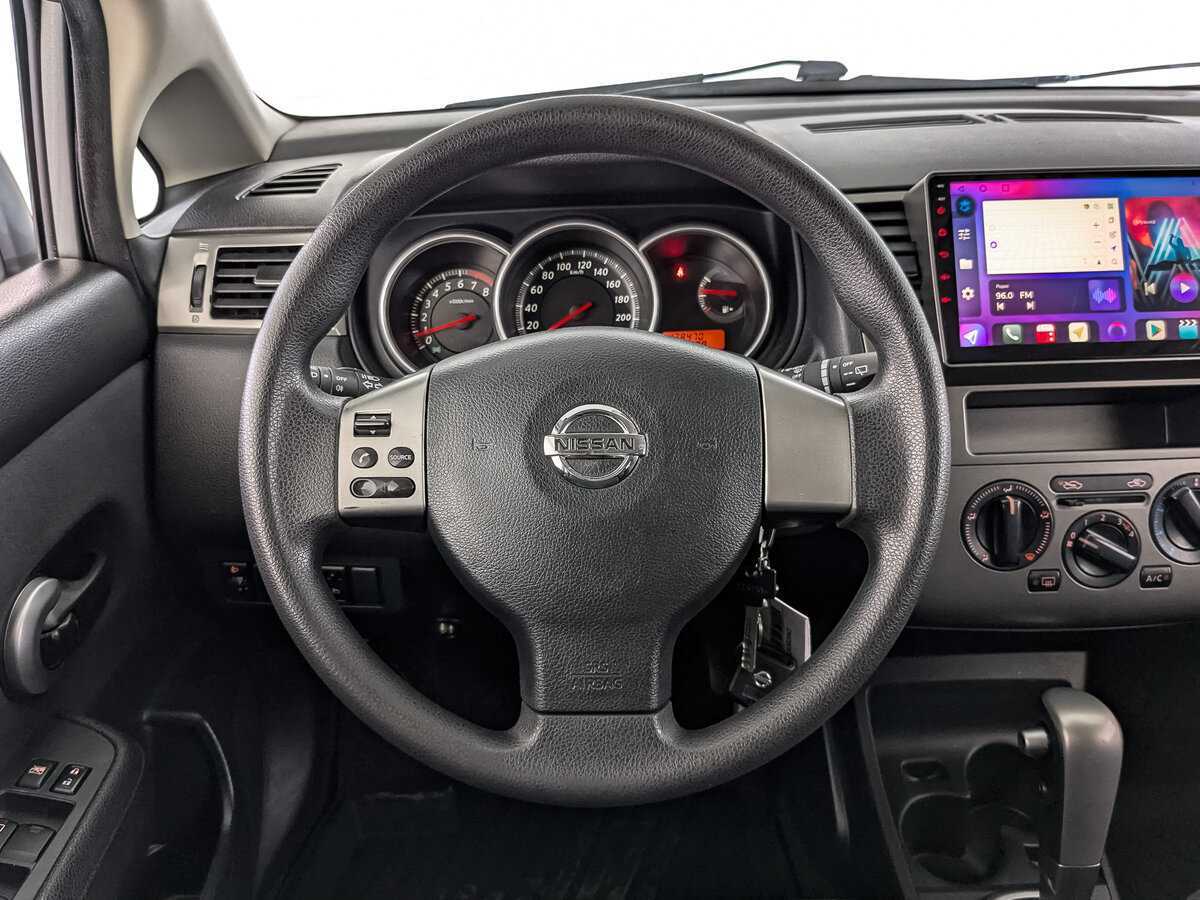 Nissan Tiida 2013 года с пробегом. Фото: #21